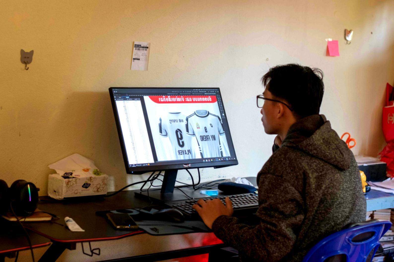 Person reviewing weekly budget spreadsheet with coffee
