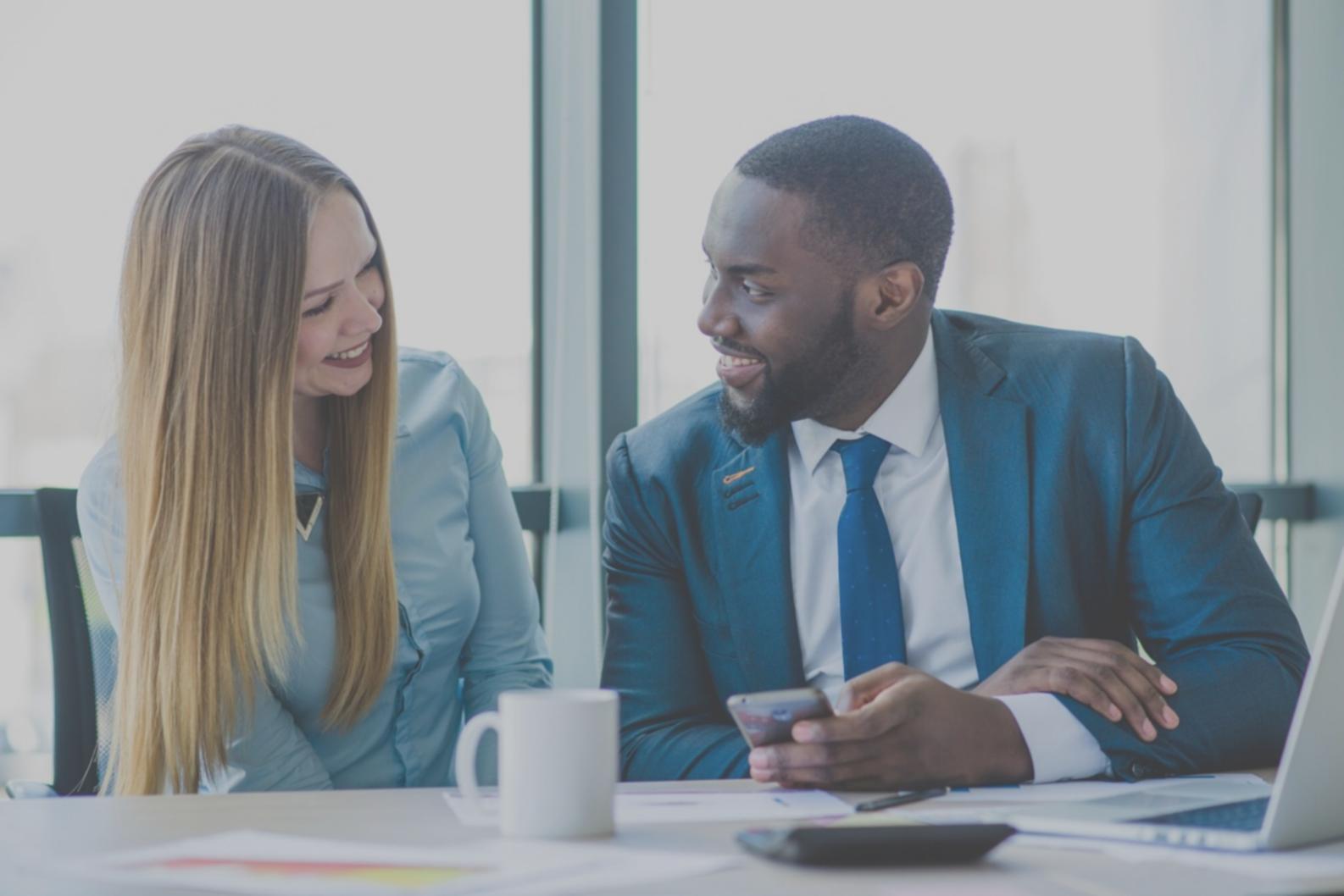 Group learning session with participants discussing budget strategies around table